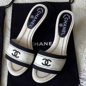 Vintage black and white Chanel mules
